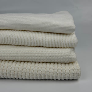 Cotton thermal waffle knit fabric by the yard, four weights stacked from light thermal to heavy waffle