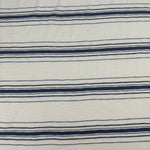 Navy stripe cotton slub jersey laid flat, showing stripe repeat