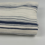 Folded navy stripe cotton slub jersey, close-up of the knit