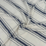 Cotton slub jersey with navy stripes, swirled to show drape