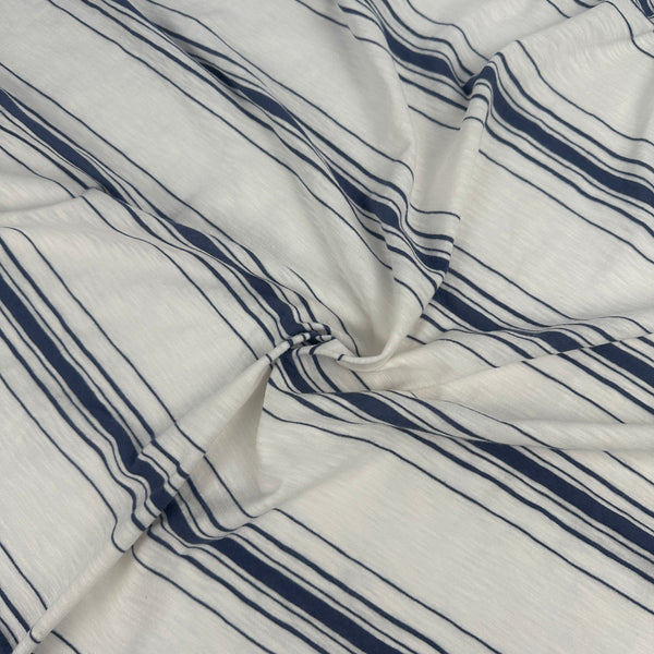 Cotton slub jersey with navy stripes, swirled to show drape