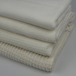 Four cotton thermal waffle knit weights folded, side view of texture and thickness