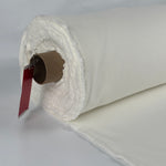 Roll of brushed cotton fleece, PFD natural white, showing the brushed loft at the edge