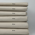 Six weights of natural undyed cotton duck canvas with each weight centered on its fabric, from 10 oz to 24 oz