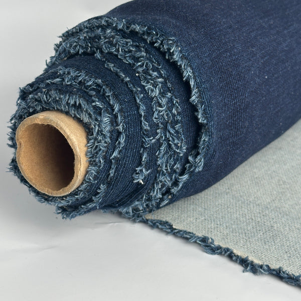 Roll of indigo cotton double knit with light gray back