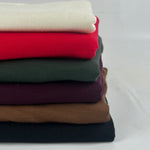Stack of modal French terry in six colors, side view