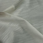 Supima slub jersey knit in undyed PFD white, swirled to show the slub texture