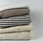 Lightweight cotton French terry fabric, 10 oz (200 GSM), stack of colors: white, beige modal, blue stripe, confetti nep and oatmeal speckled