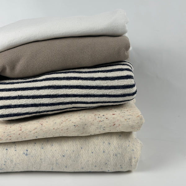 Lightweight cotton French terry fabric, 10 oz (200 GSM), stack of colors: white, beige modal, blue stripe, confetti nep and oatmeal speckled