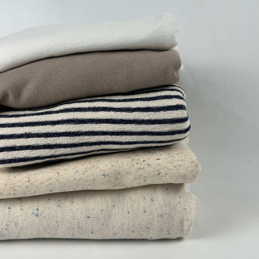 Lightweight cotton French terry fabric, 10 oz (200 GSM), stack of colors: white, beige modal, blue stripe, confetti nep and oatmeal speckled