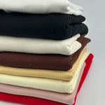 Medium weight cotton 1x1 rib knit fabric for collars, cuffs and necklines, folded stack