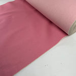 Pink selvedge denim laid flat